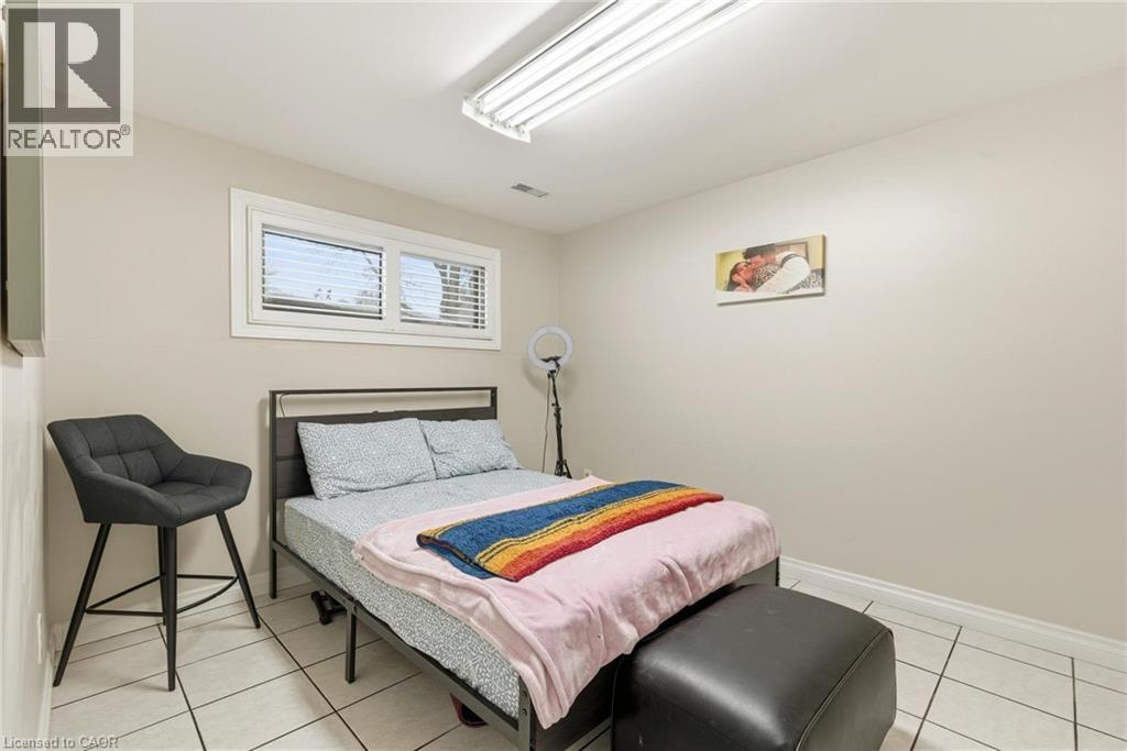 Bedroom featuring light tile patterned floors and baseboards - 364 Roselawn Place, Waterloo, ON - Indoor Photo Showing Bedroom