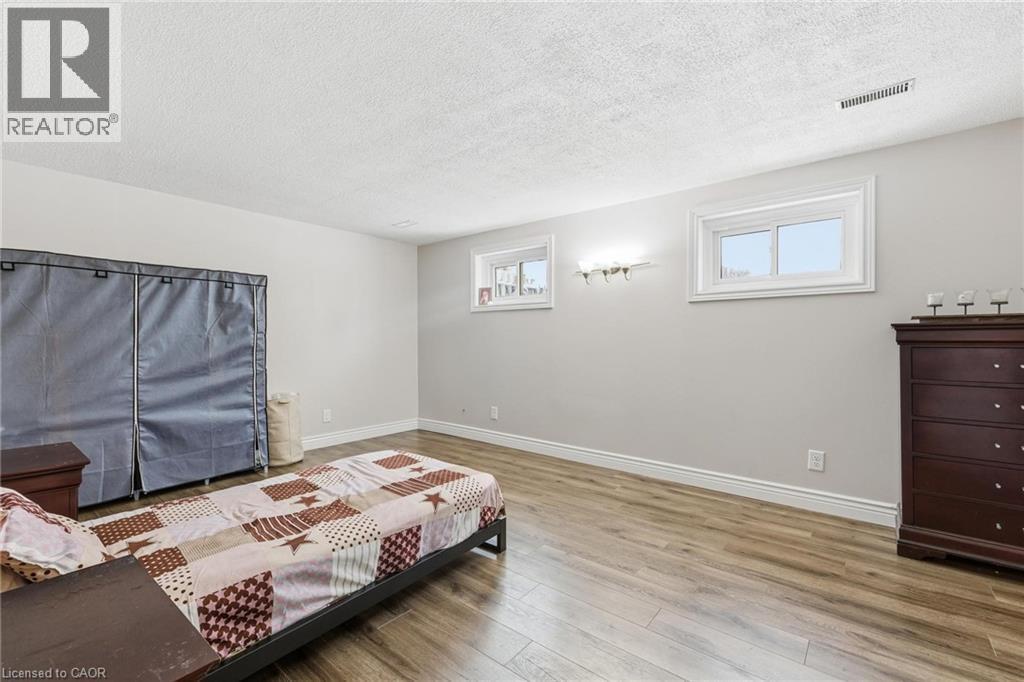 Bedroom with wood-type flooring and a textured ceiling - 364 Roselawn Place, Waterloo, ON - Indoor Photo Showing Bedroom
