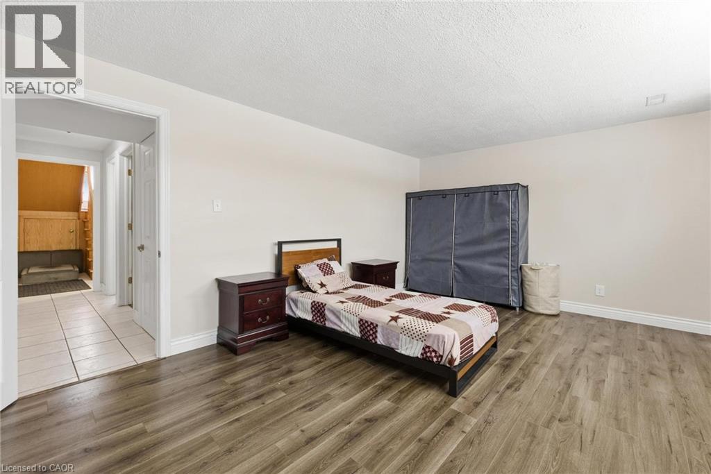 Bedroom with wood finished floors and a textured ceiling - 364 Roselawn Place, Waterloo, ON - Indoor Photo Showing Bedroom