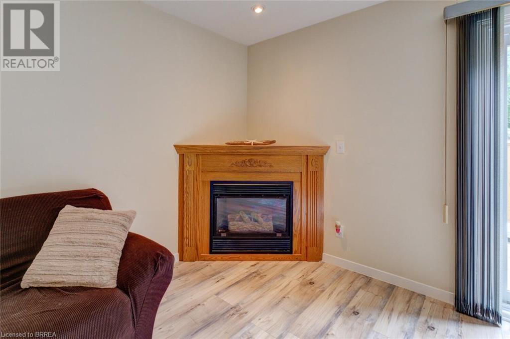 32 Montclair Crescent Unit# 16, Simcoe, ON - Indoor Photo Showing Living Room With Fireplace