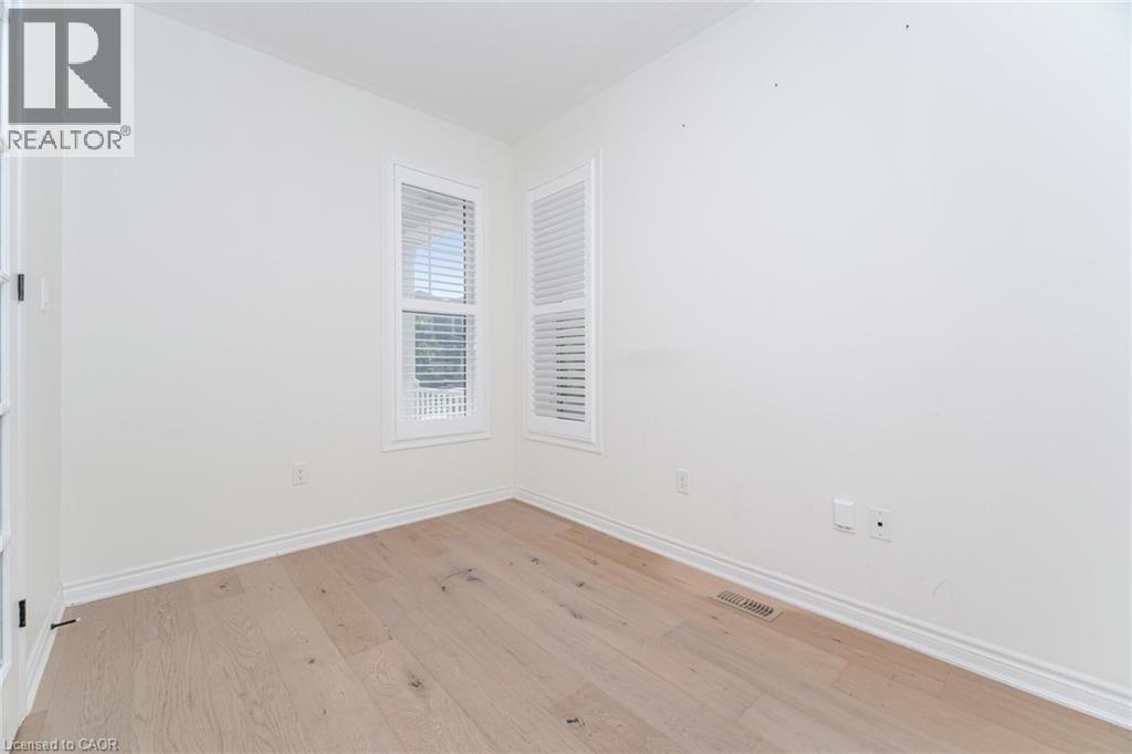 Unfurnished room with light wood-style flooring and baseboards - 28 Pickett Place, Cambridge, ON - Indoor Photo Showing Other Room