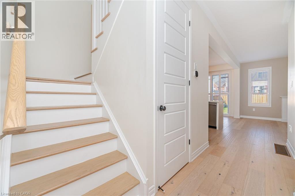 Staircase with hardwood / wood-style flooring and baseboards - 28 Pickett Place, Cambridge, ON - Indoor Photo Showing Other Room