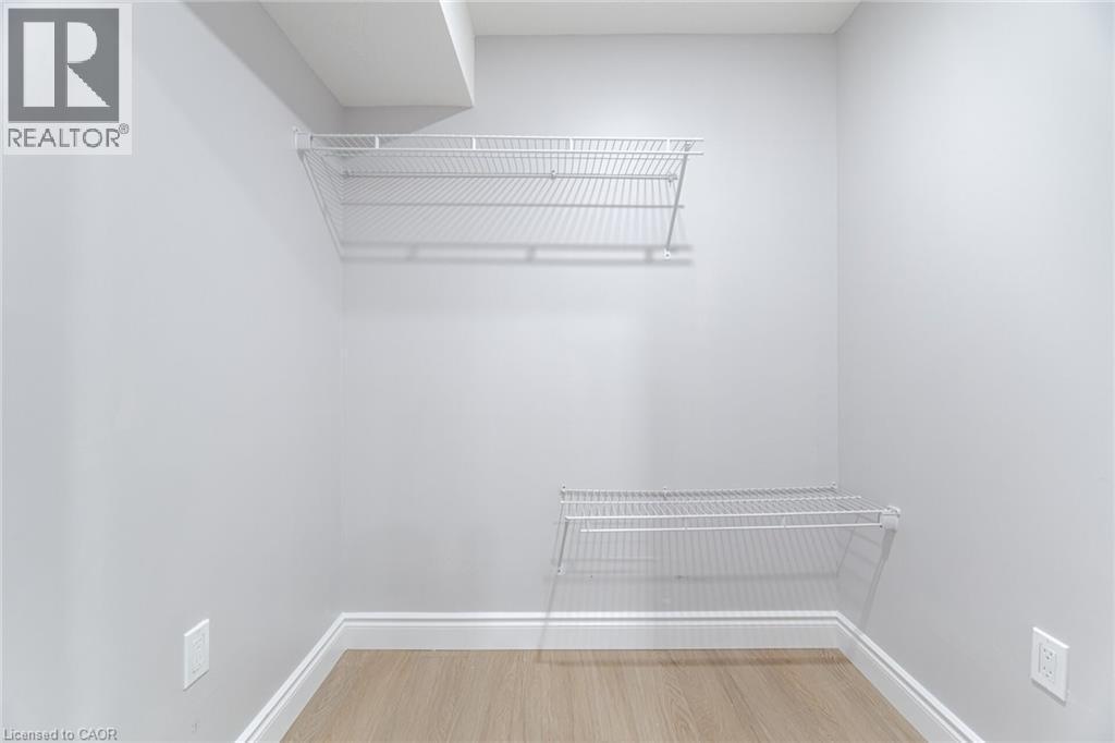 Spacious closet with light wood-style floors - 28 Pickett Place, Cambridge, ON - Indoor With Storage