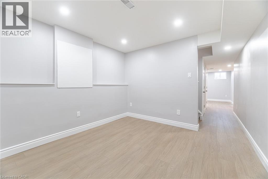 Unfurnished room with light wood finished floors and recessed lighting - 28 Pickett Place, Cambridge, ON - Indoor Photo Showing Other Room