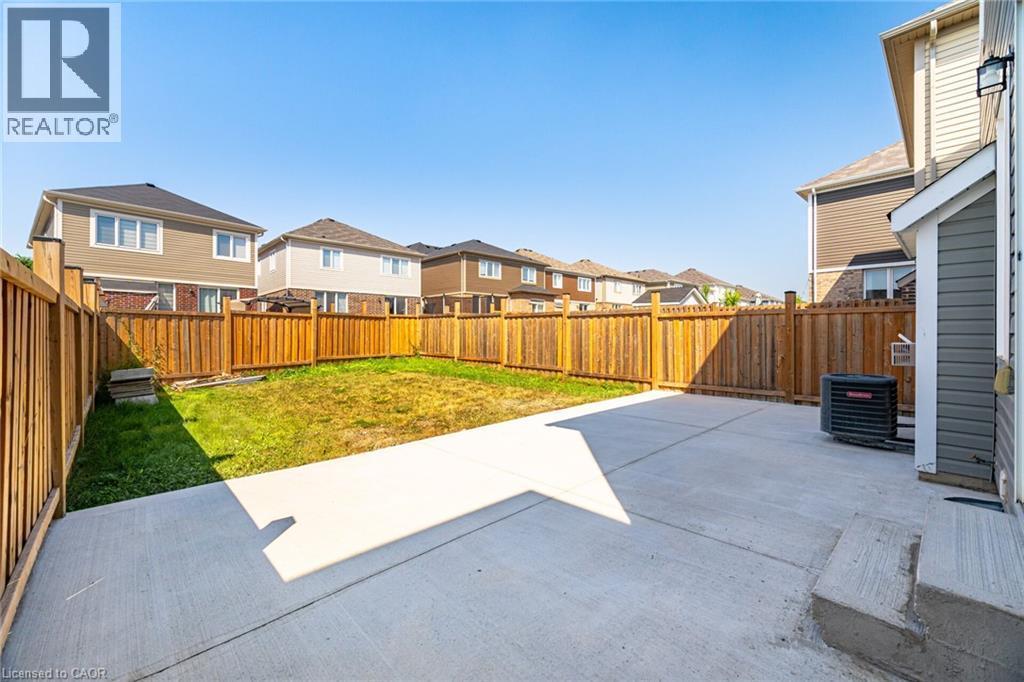 Fenced backyard featuring a patio and a residential view - 28 Pickett Place, Cambridge, ON - Outdoor