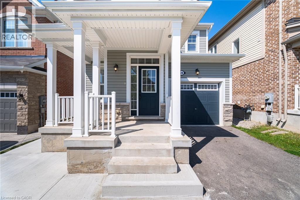Doorway to property with a porch, driveway, and stone siding - 28 Pickett Place, Cambridge, ON - Outdoor With Facade