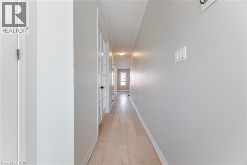 Hallway with light wood-style floors and baseboards - 28 Pickett Place, Cambridge, ON - Indoor Photo Showing Other Room