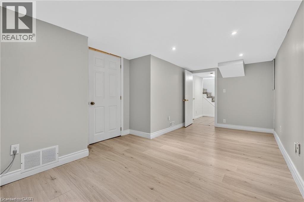 Unfurnished recreation or living room lower level - 111 Hillyard Street, Hamilton, ON - Indoor Photo Showing Other Room