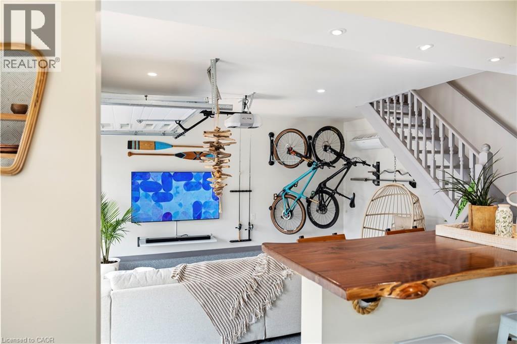 Bar featuring wooden counters, stairs, and recessed lighting - 197 Cedar Drive, Turkey Point, ON - Indoor Photo Showing Other Room