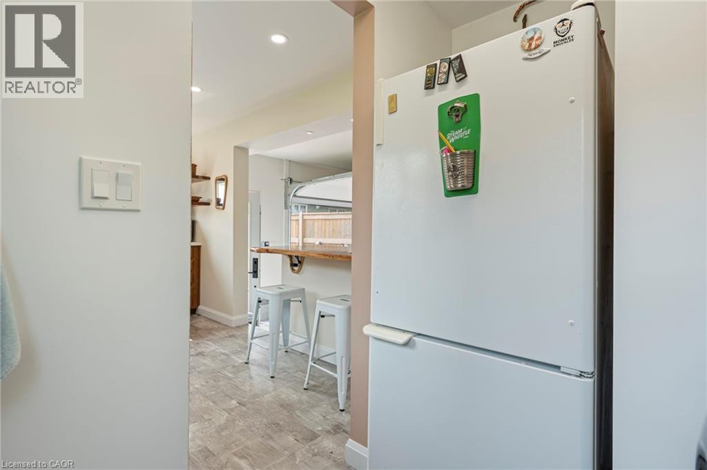 Corridor with light wood finished floors and recessed lighting - 197 Cedar Drive, Turkey Point, ON - Indoor