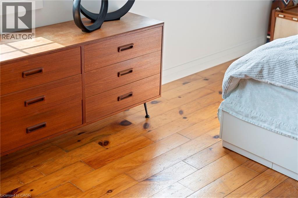 Bedroom featuring light wood-type flooring and baseboards - 197 Cedar Drive, Turkey Point, ON - Indoor