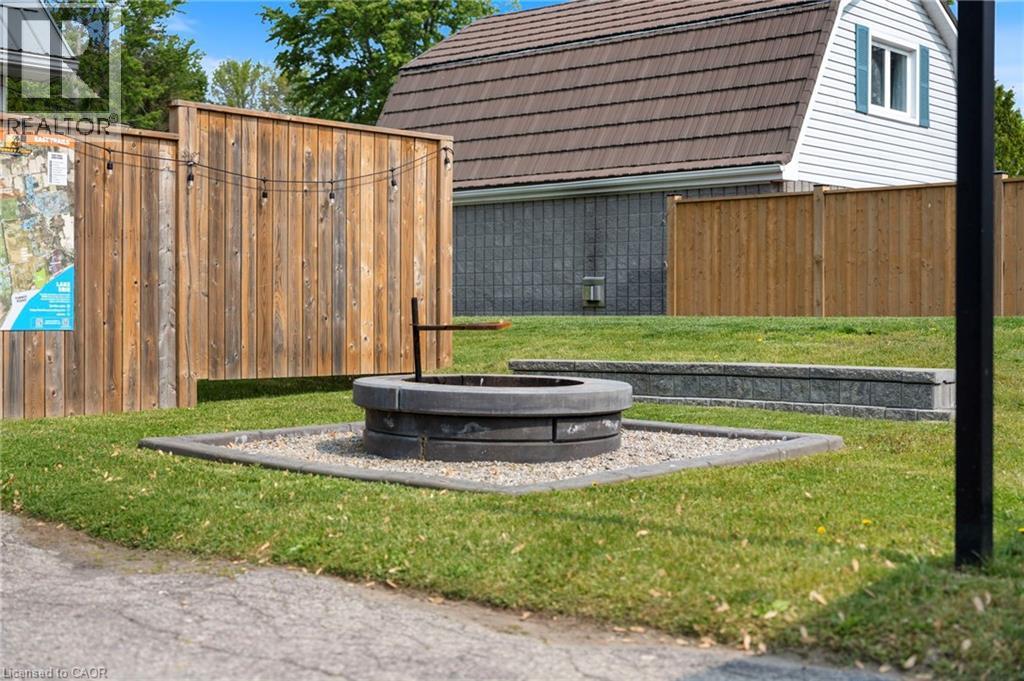 View of yard featuring a fire pit - 197 Cedar Drive, Turkey Point, ON - Outdoor