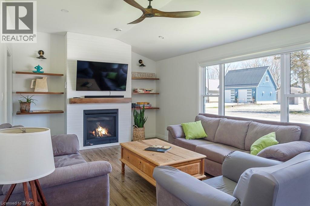 197 Cedar Drive, Turkey Point, ON - Indoor Photo Showing Living Room With Fireplace