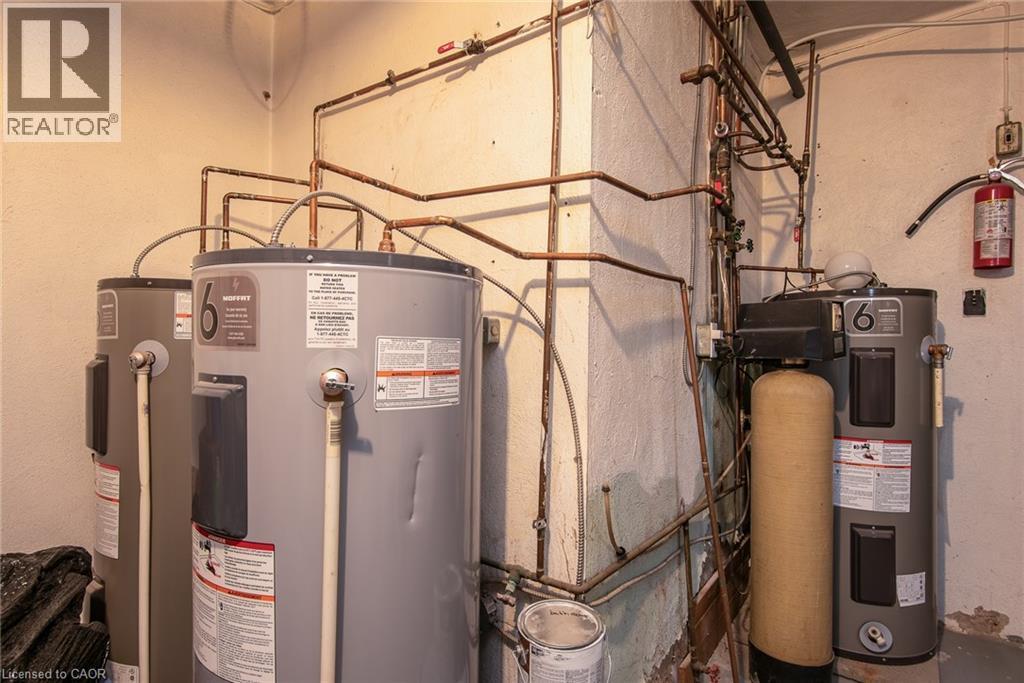 Utilities featuring electric water heater - 129 River Road E, Kitchener, ON - Indoor Photo Showing Basement