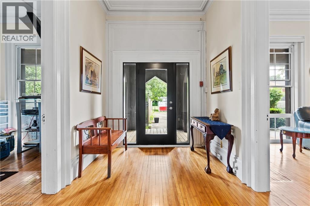 Foyer entrance featuring light wood-type flooring and ornamental molding - 5368 Menzie Street, Niagara Falls, ON - Indoor Photo Showing Other Room