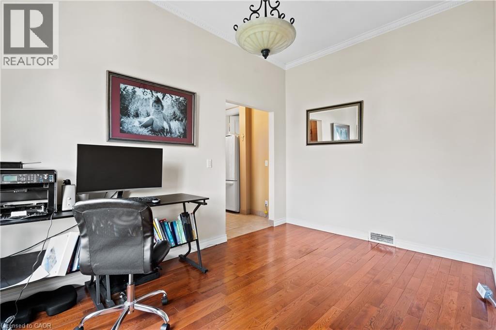 Office area featuring crown molding and wood finished floors - 5368 Menzie Street, Niagara Falls, ON - Indoor Photo Showing Office