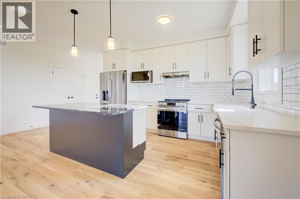 117 Thackeray Way, Harriston, ON - Indoor Photo Showing Kitchen With Upgraded Kitchen