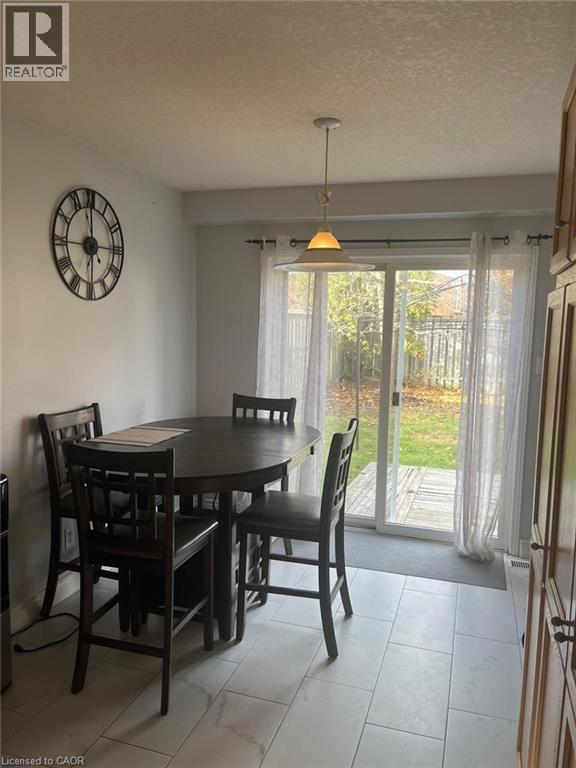 Dining area featuring a textured ceiling - 110 Adler Drive, Cambridge, ON - Indoor Photo Showing Dining Room