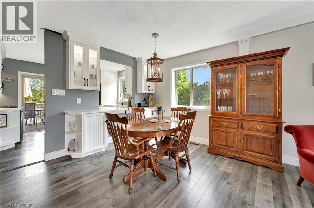 Dining space featuring light wood-style flooring and baseboards - 1565 Old Brock Street, Vittoria, ON - Indoor Photo Showing Dining Room