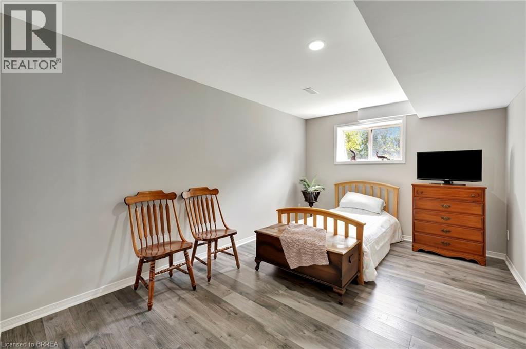 Bedroom featuring light wood-type flooring and baseboards - 1565 Old Brock Street, Vittoria, ON - Indoor