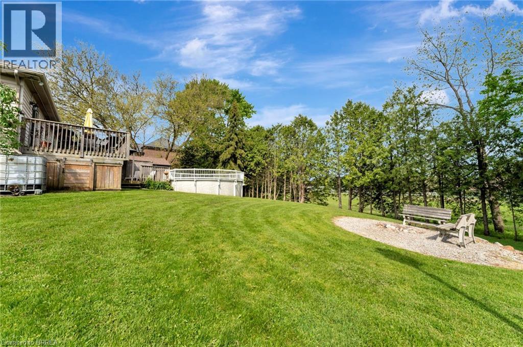 View of green lawn with view of scattered trees - 1565 Old Brock Street, Vittoria, ON - Outdoor