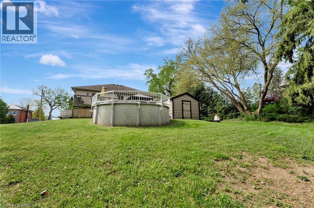 View of green lawn featuring a shed - 1565 Old Brock Street, Vittoria, ON - Outdoor