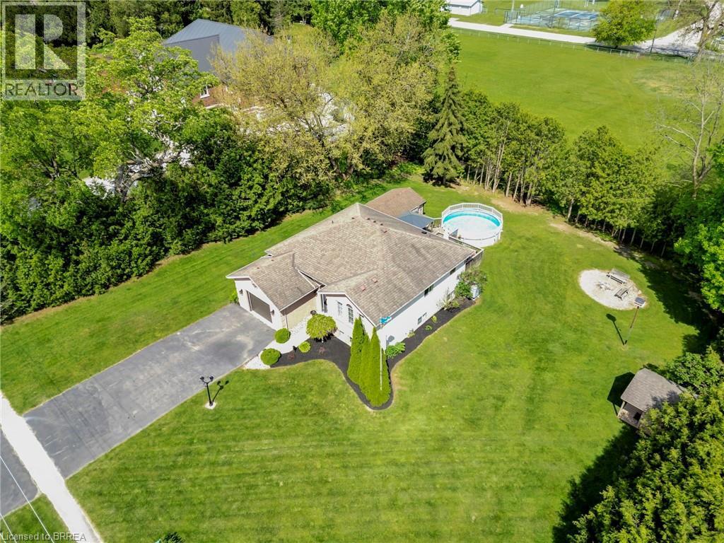 View of subject property featuring a pool area - 1565 Old Brock Street, Vittoria, ON - Outdoor With View