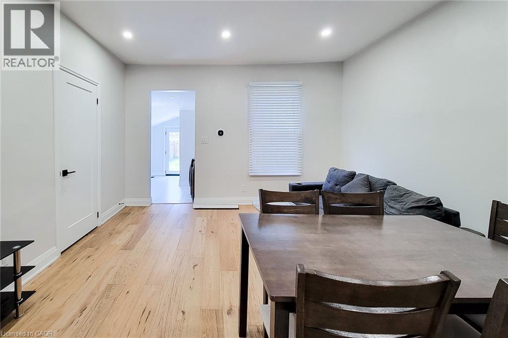 Dining area featuring light wood-style floors and recessed lighting - 51 West Avenue N, Hamilton, ON - Indoor Photo Showing Other Room