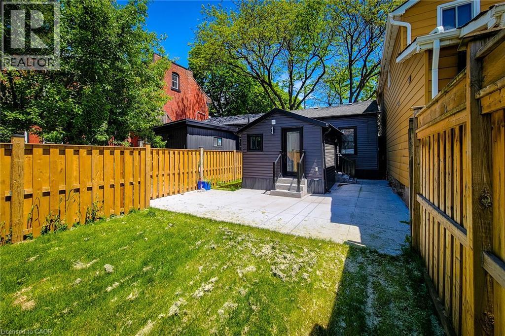 Fenced backyard featuring a patio area and entry steps - 51 West Avenue N, Hamilton, ON - Outdoor