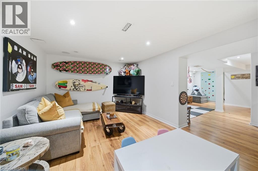 Living area featuring light wood-type flooring and recessed lighting - 136 Braemar Avenue, Caledonia, ON - Indoor Photo Showing Living Room