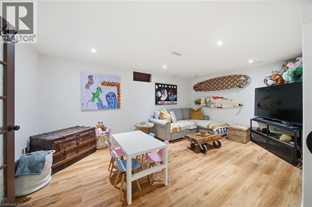 Living area with light wood-type flooring and recessed lighting - 136 Braemar Avenue, Caledonia, ON - Indoor