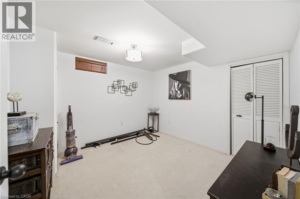 Exercise room with carpet floors and baseboards - 136 Braemar Avenue, Caledonia, ON - Indoor Photo Showing Other Room