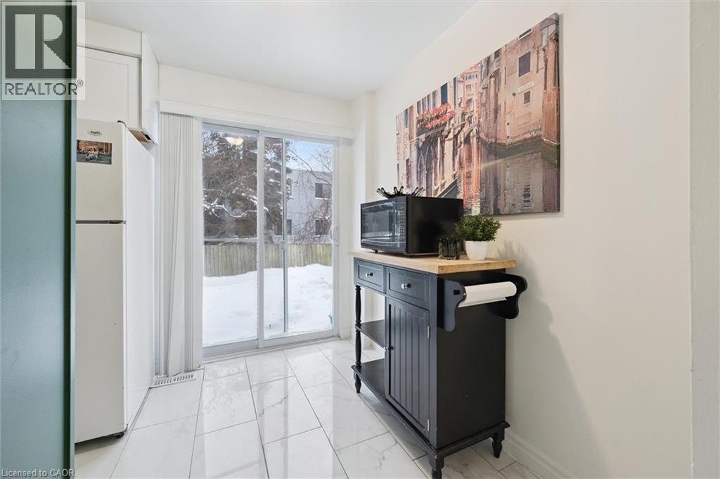 Doorway to outside with marble look tiles - 11 Ingleside Drive, Kitchener, ON - Indoor Photo Showing Other Room