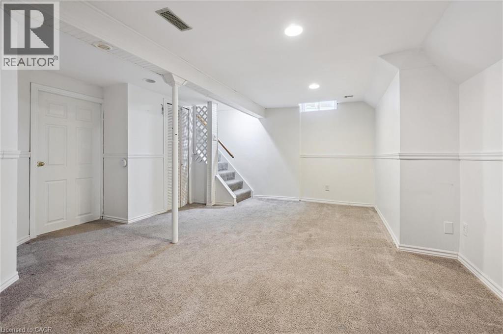 Finished basement with stairs, light carpet, and recessed lighting - 11 Ingleside Drive, Kitchener, ON - Indoor Photo Showing Other Room