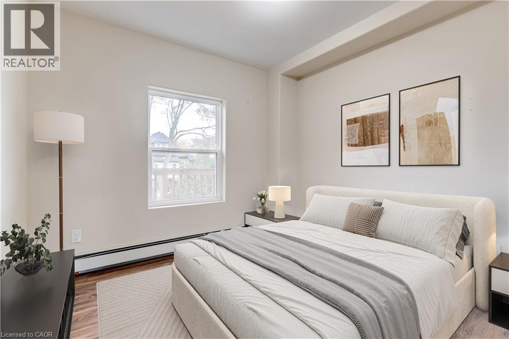 Staged Bed Upper unit - 152 Sanford Avenue S, Hamilton, ON - Indoor Photo Showing Bedroom