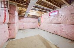 Basement featuring electric panel -