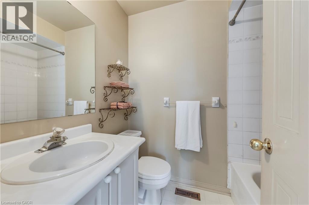 Full bathroom featuring vanity, tile patterned flooring, and bathing tub / shower combination - 1157 Charminster Crescent, Mississauga, ON - Indoor Photo Showing Bathroom