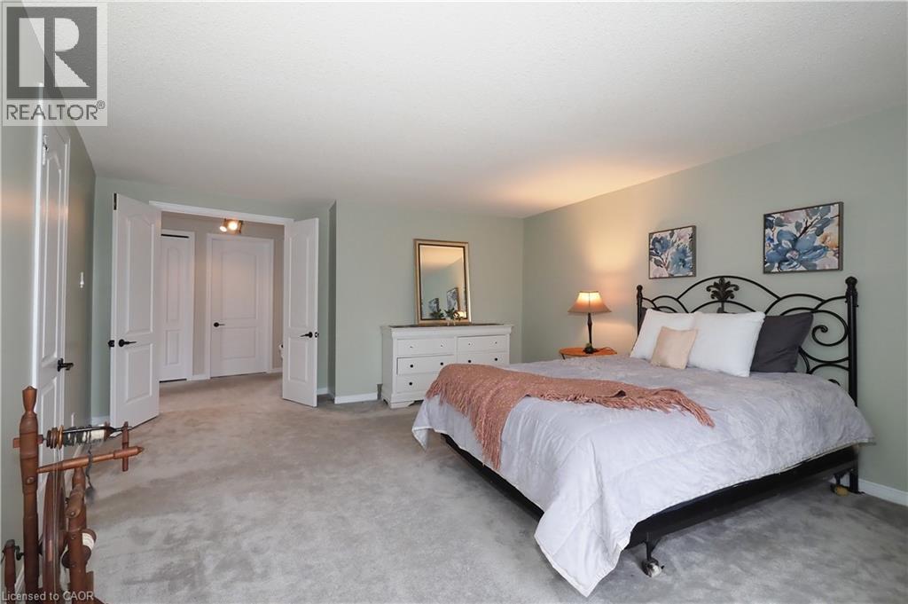 Large primary bedroom with double door entrance - 511 Oakvale Drive Unit# 1, Waterloo, ON - Indoor Photo Showing Bedroom