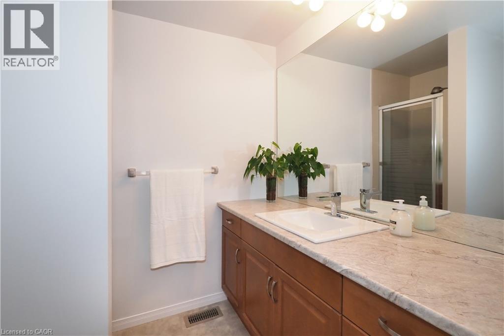 Ensuite 3-piece bathroom featuring large vanity, full size mirror and a stall shower - 511 Oakvale Drive Unit# 1, Waterloo, ON - Indoor Photo Showing Bathroom