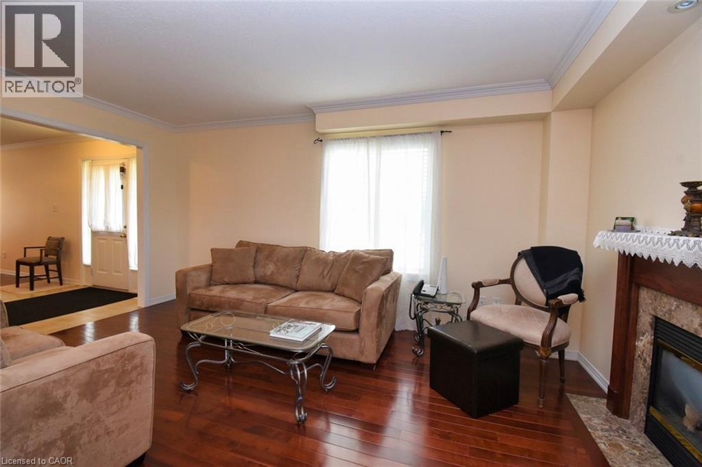 7 Southside Place Unit# 49, Hamilton, ON - Indoor Photo Showing Living Room With Fireplace