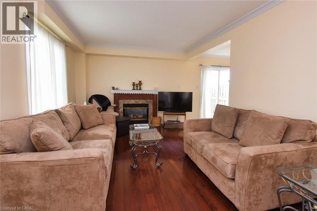 7 Southside Place Unit# 49, Hamilton, ON - Indoor Photo Showing Living Room With Fireplace
