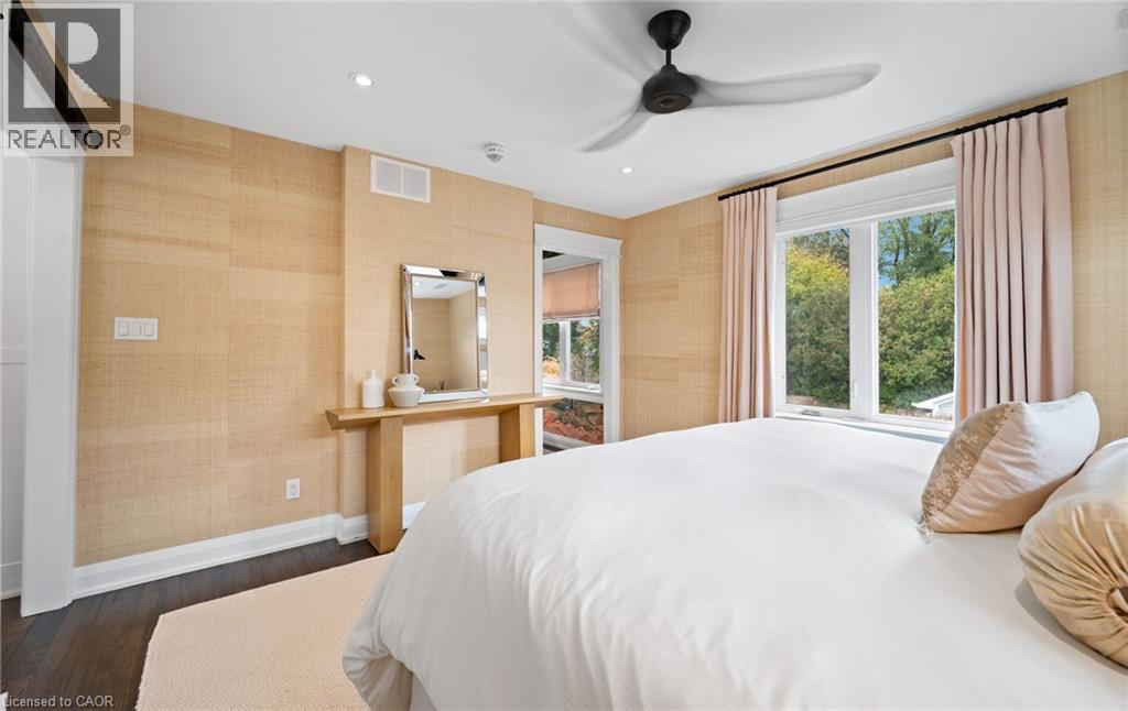 Bedroom featuring dark wood finished floors, recessed lighting, ceiling fan, and wallpapered walls - 735 George Street, Burlington, ON - Indoor Photo Showing Bedroom