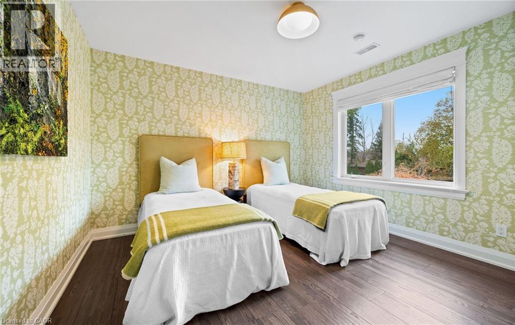 Bedroom with wallpapered walls and wood finished floors - 735 George Street, Burlington, ON - Indoor Photo Showing Bedroom