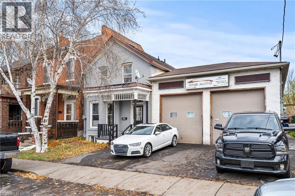 View of front facade featuring asphalt driveway and an attached garage - 246 Mary Street, Hamilton, ON