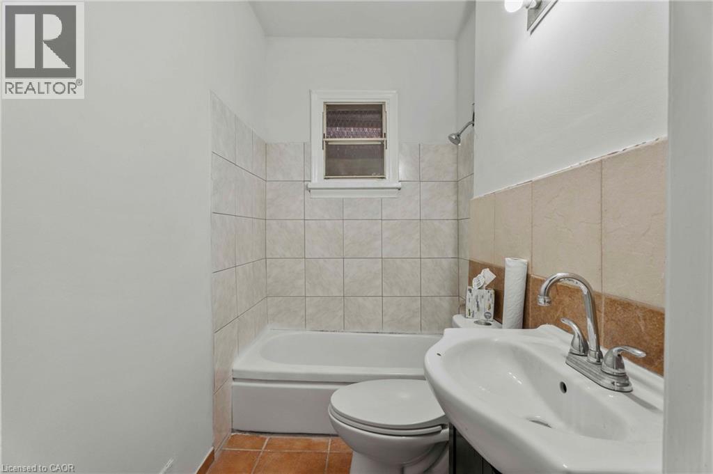 Full bath featuring tile patterned flooring, vanity, and shower / bathtub combination - 246 Mary Street, Hamilton, ON