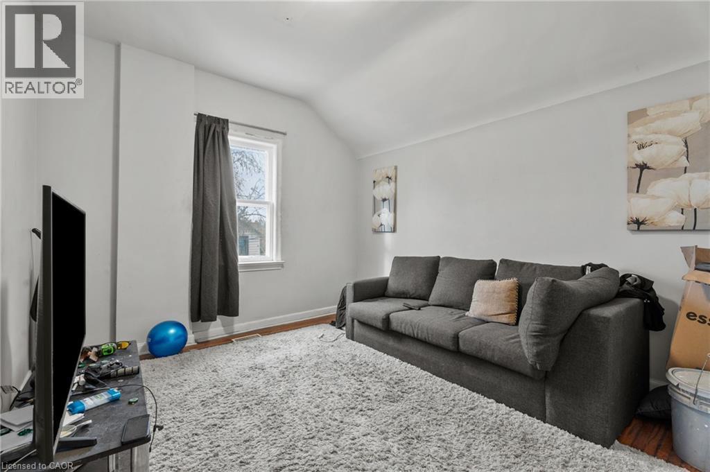 Living room featuring wood finished floors and lofted ceiling - 246 Mary Street, Hamilton, ON