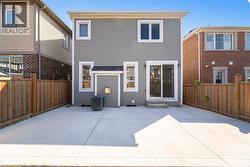 Back of house featuring a patio, a fenced backyard, and entry steps -
