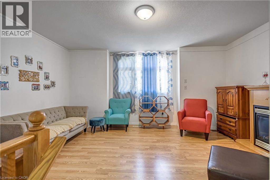 16 Jessica Street, Hamilton, ON - Indoor Photo Showing Other Room With Fireplace