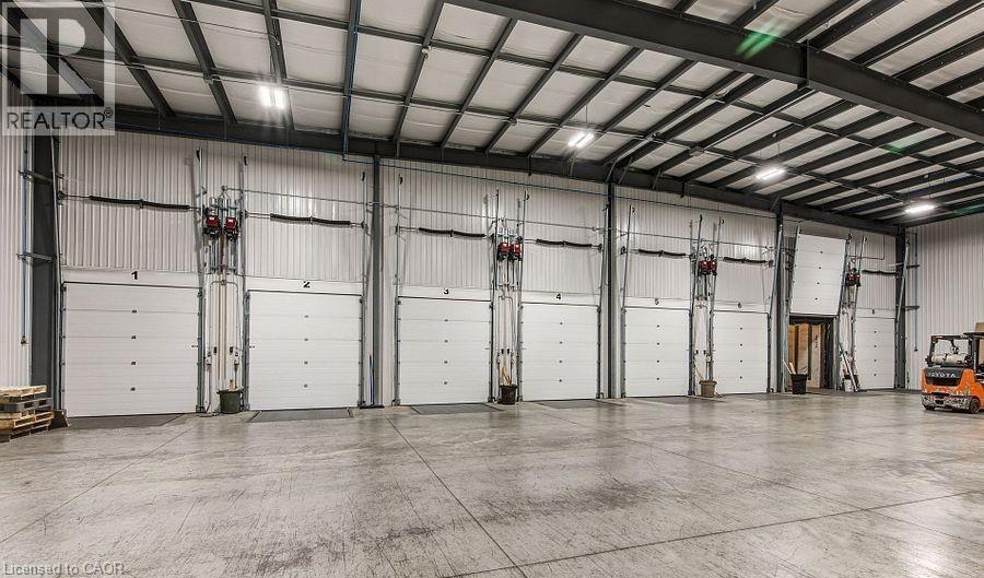 Garage with metal wall - 55 Progress Drive E, Aylmer, ON