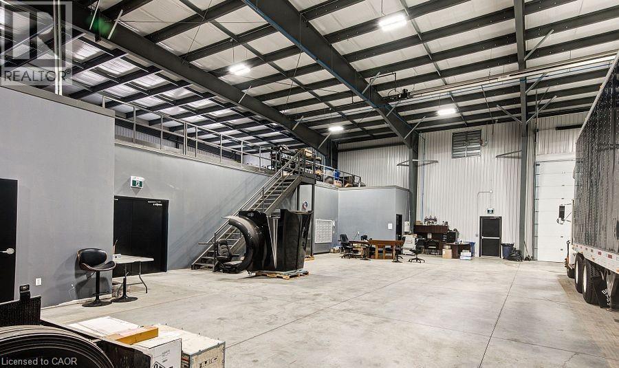 Garage featuring metal wall - 55 Progress Drive E, Aylmer, ON